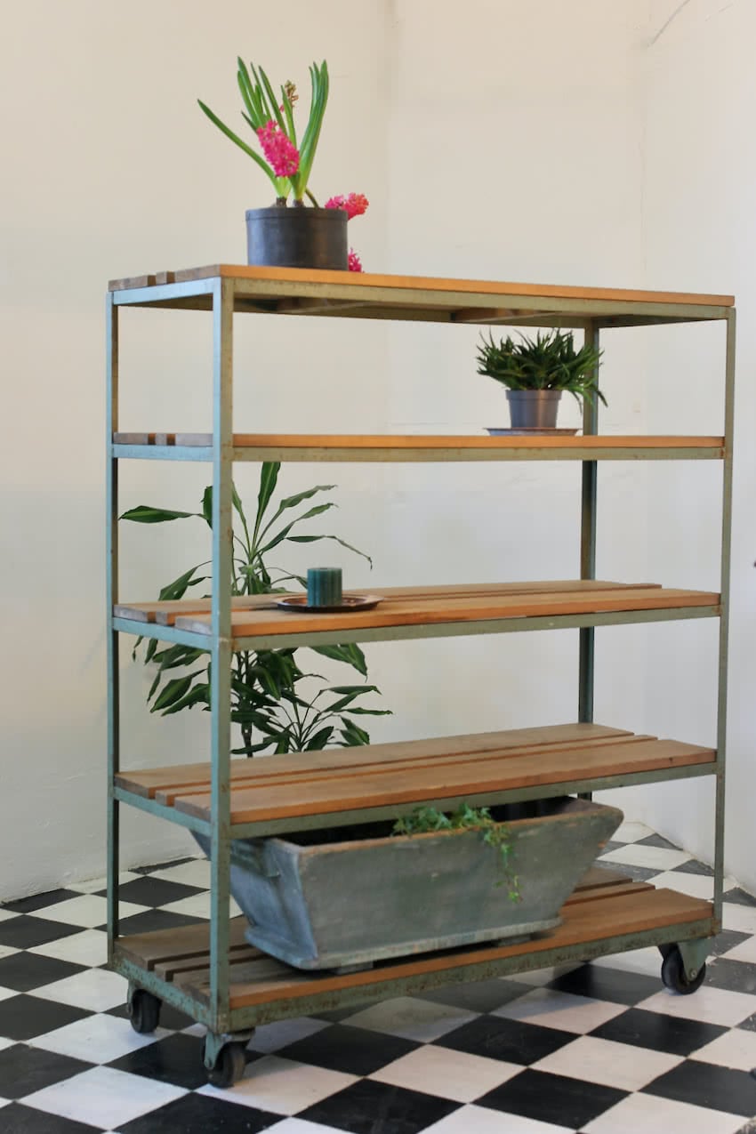 gorgeous old factory pine painted blue green metal rack with old solid pine shelves on the original casters.