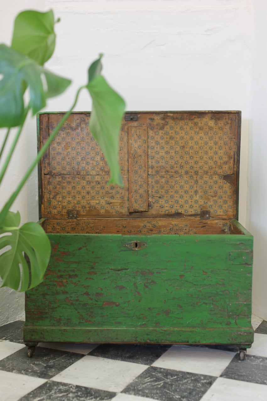 pretty original painted vivid green pine linen chest with very old lining paper inside, the chest sits on original casters.